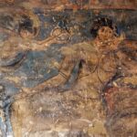Audience hall, west transverse arch view of fresco on northeast spandrel depicting a seated figure