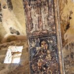 Audience hall west transverse arch view of fresco on spandrel depicting seated musician holding lute