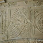 Carved stucco panel from one of the towers flanking the entrance portal 1