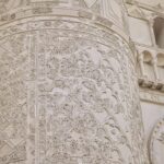 Carved stucco panel from one of the towers flanking the entrance portal
